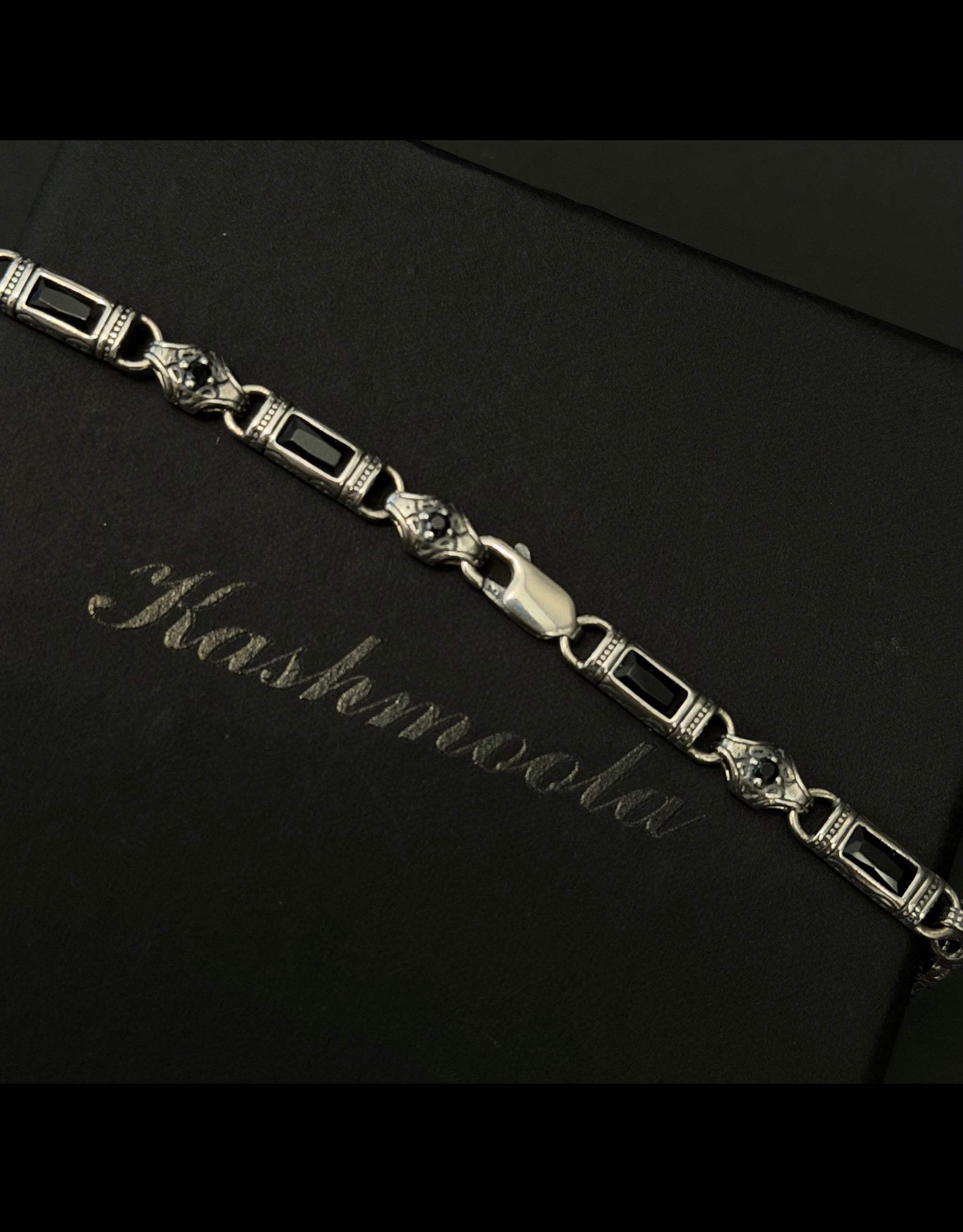 Genuine 925 sterling silver heritage-inspired bracelet with intricate decorative details, polished finish, available in black, blue, and green accent options, 21.5 cm length.