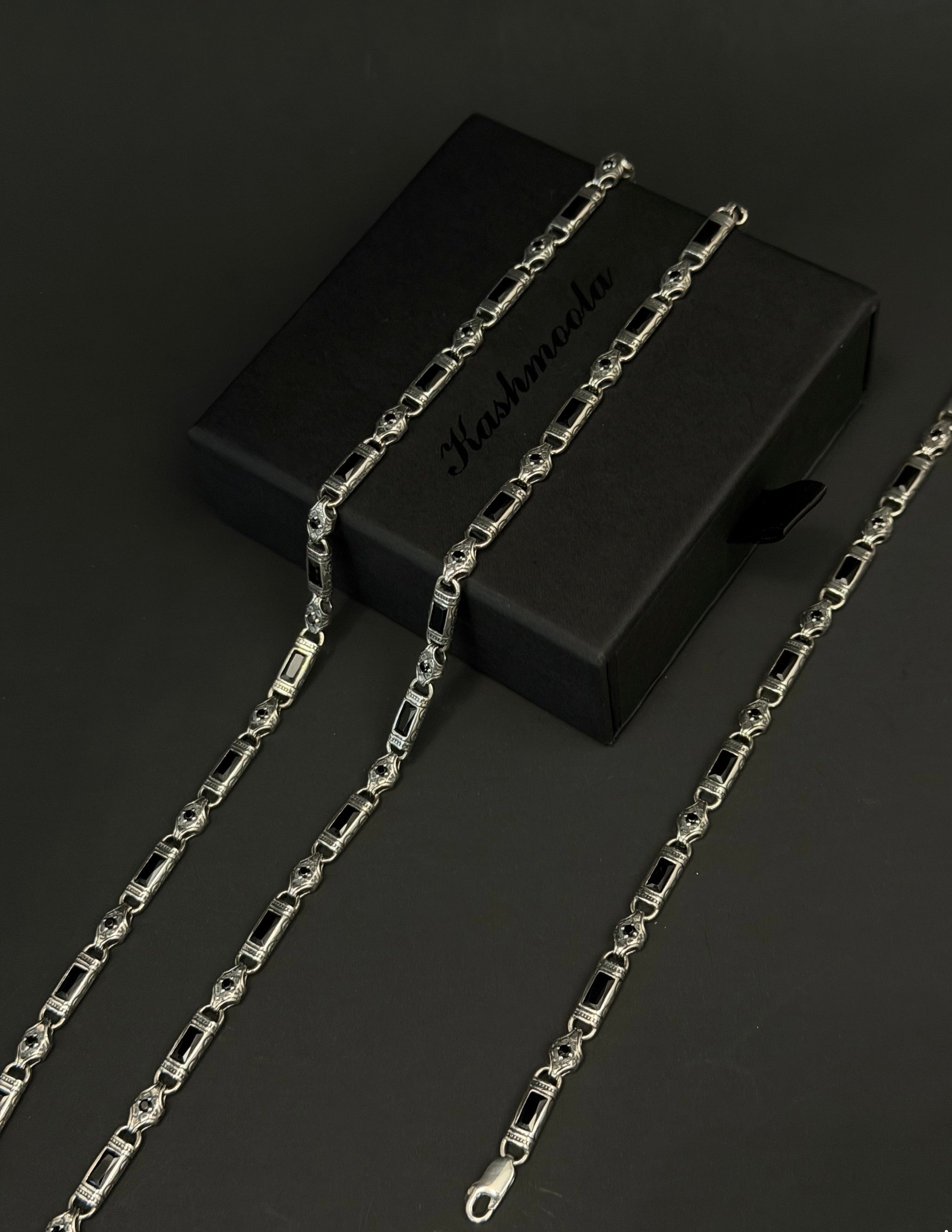 Genuine 925 sterling silver heritage-inspired jewelry featuring black rectangular accents and intricate decorative details. Available as a bracelet or necklace in multiple color options.